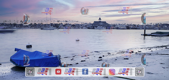 Blue canoe in the foreground Balboa Island Newport beach overlooking the fun zone